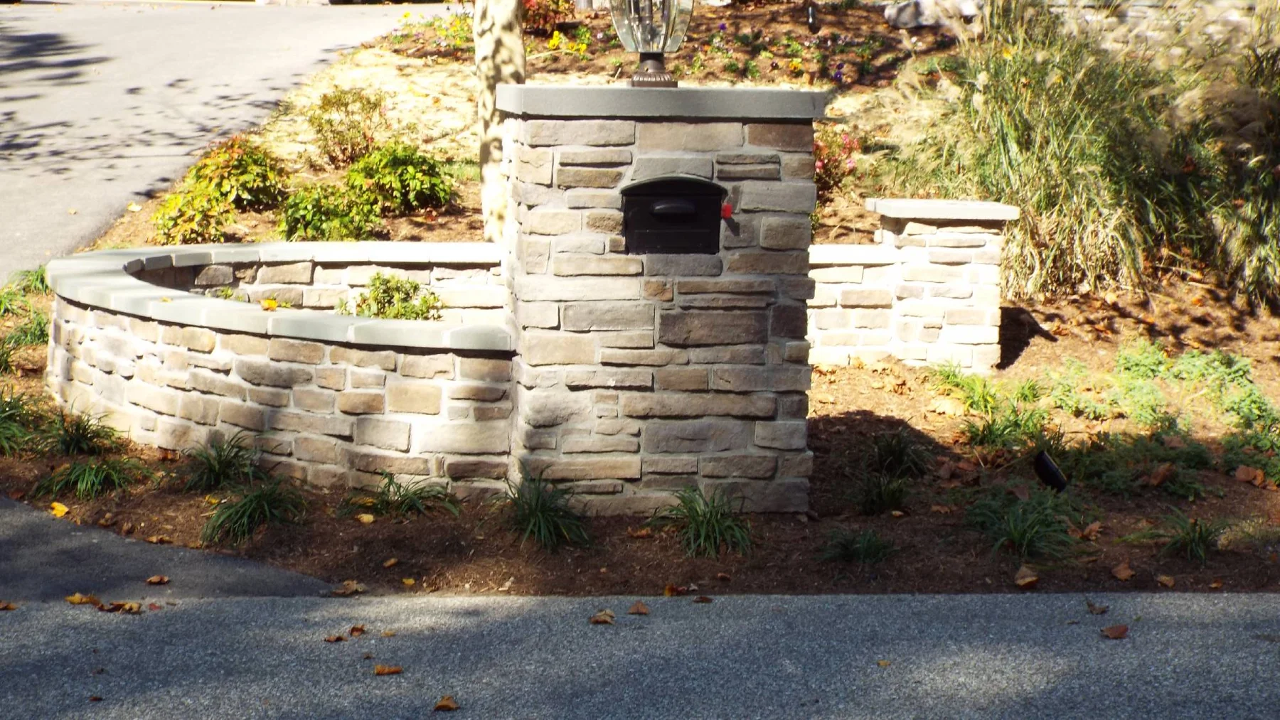 Stone pillars and curved wall