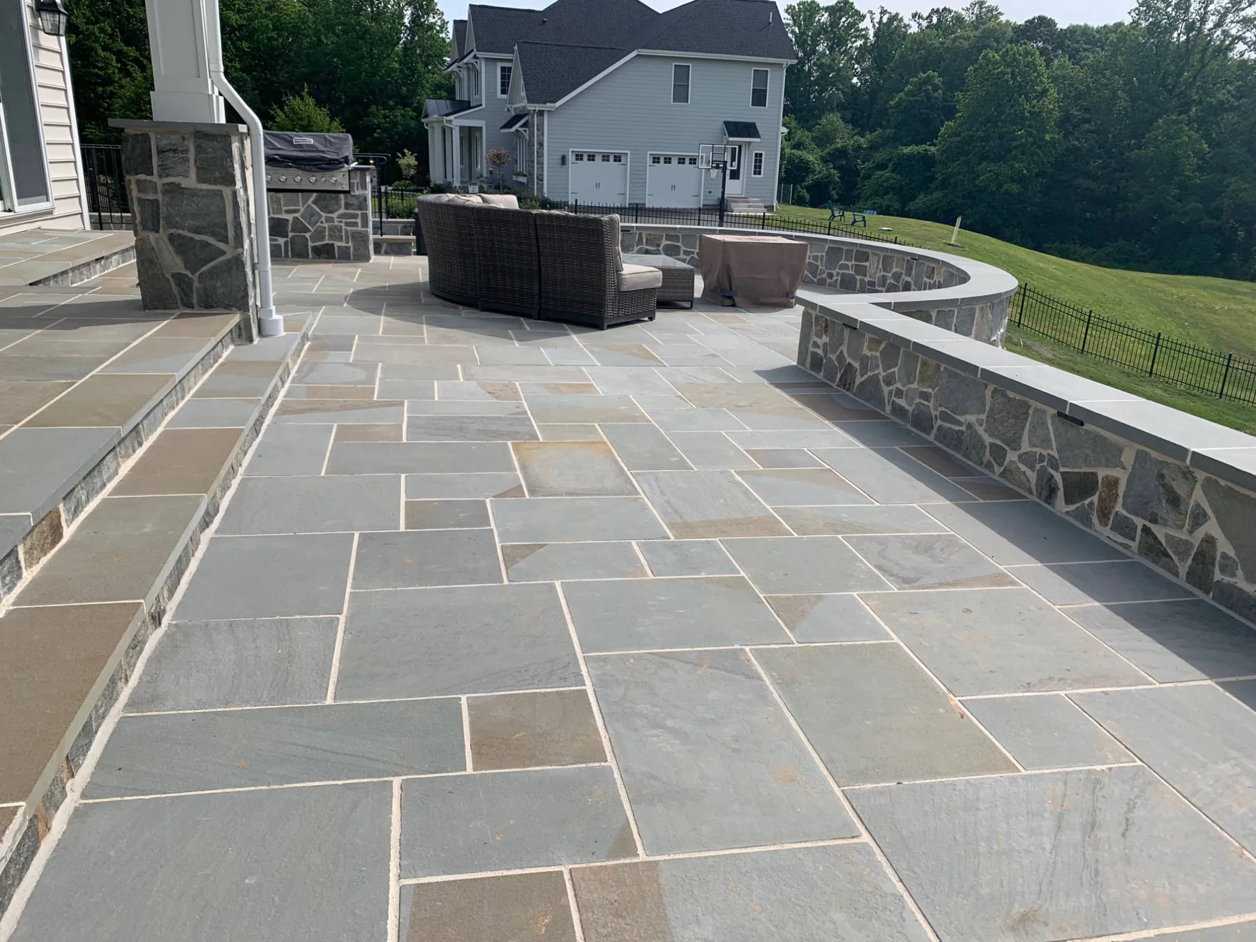 Stone patio and seating wall